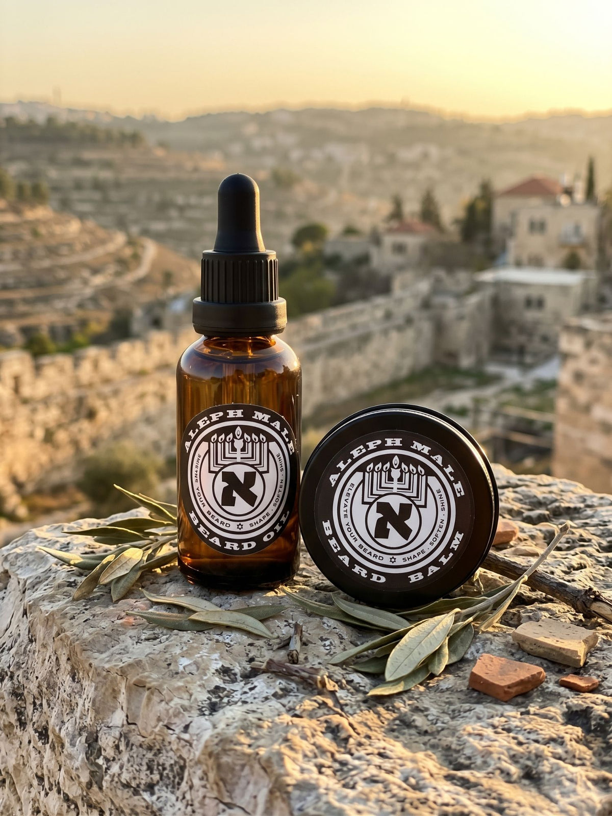 Aleph Male beard oil and beard balm on Jerusalem stone with olive leaves
