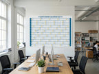 The Giant Jewish Calendar 2027 Jewish wall calendar on the wall of a bright open office