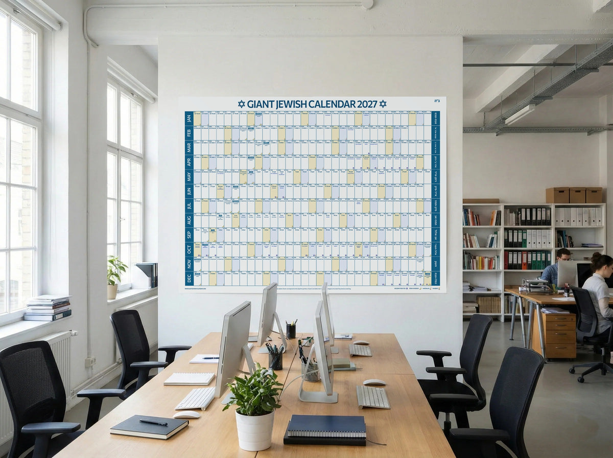 The Giant Jewish Calendar 2027 Jewish wall calendar on the wall of a bright open office