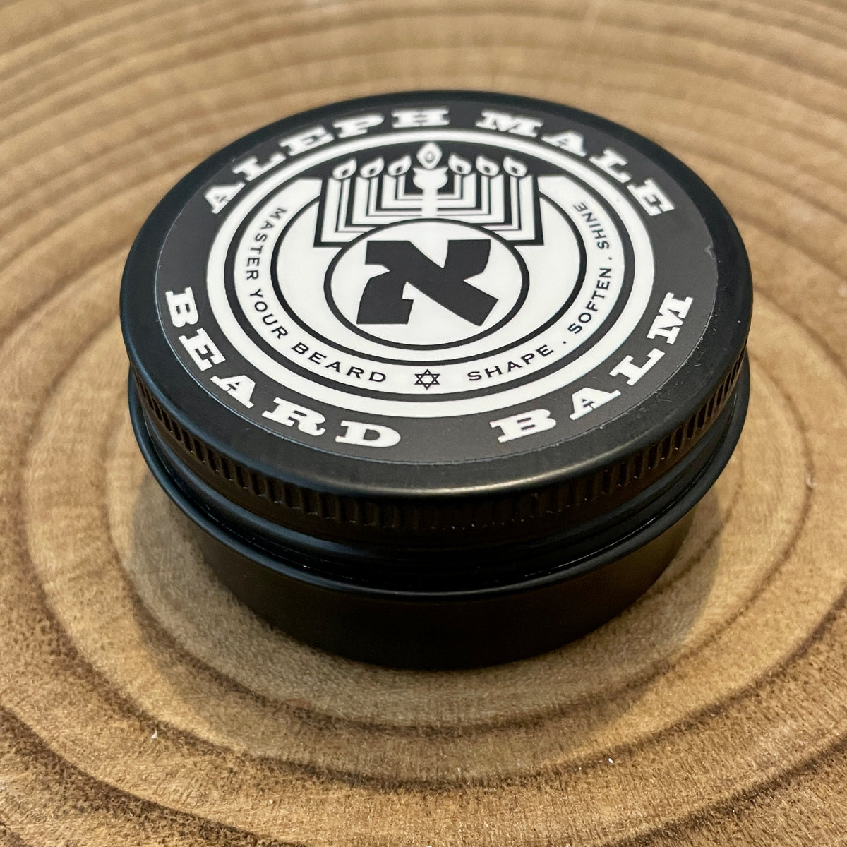Man with well-groomed beard using Aleph Male Yesod unscented natural beard balm