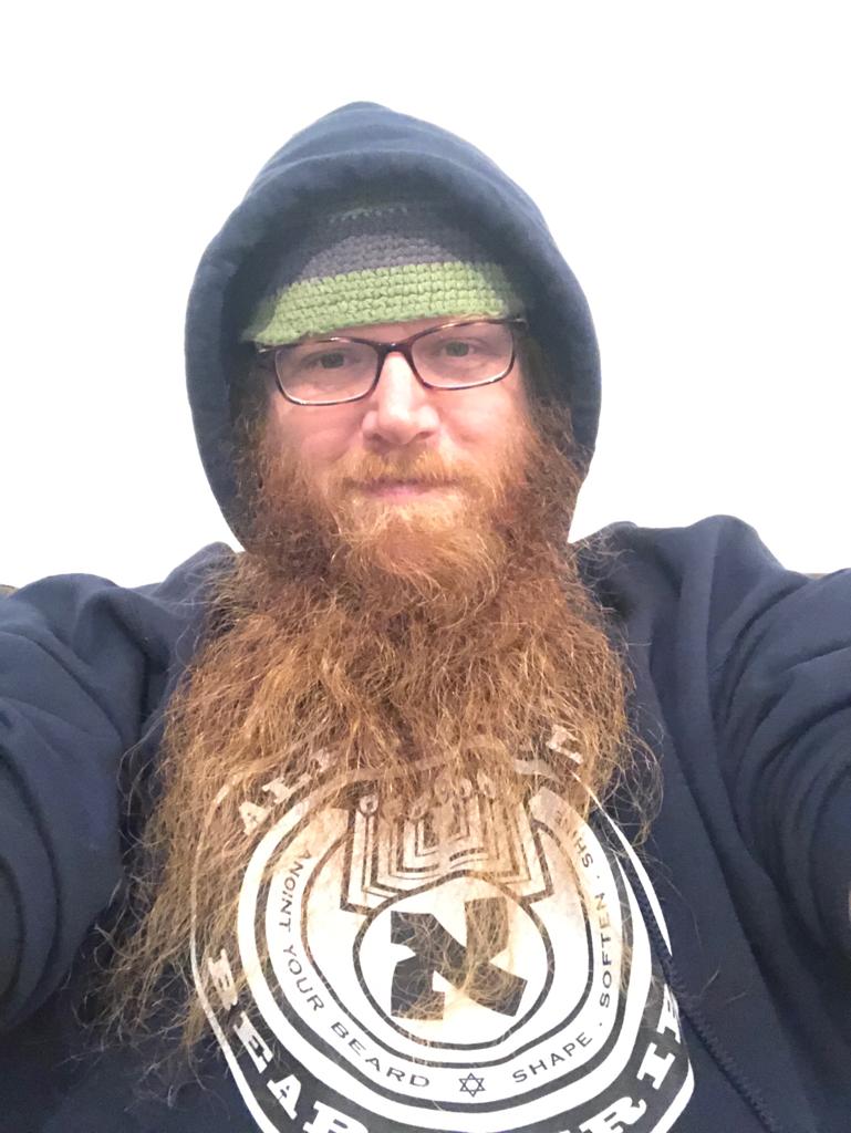 Person wearing Aleph Male branded hoodie — Jerusalem beard care lifestyle apparel